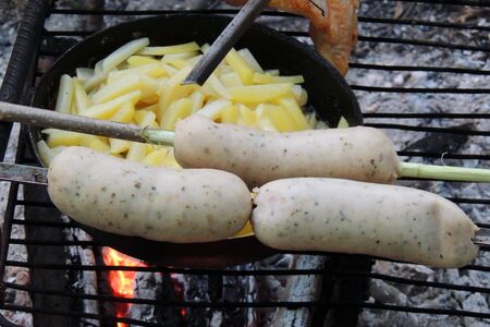 Close up view slices of smoked sausage with parsley and rye blackの写真素材