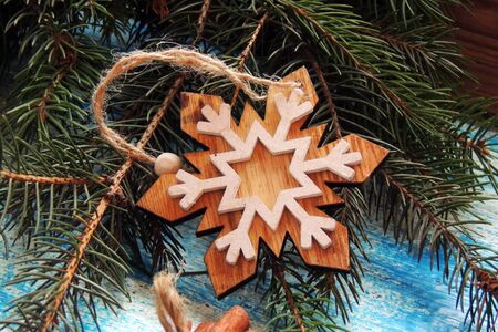 Christmas fir tree with decoration on dark wooden boardの写真素材