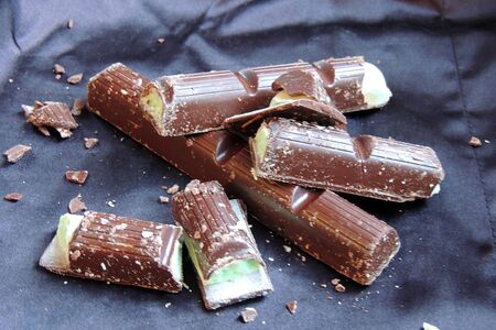 Close-up of some After Dinner mints chocolate over rustic background