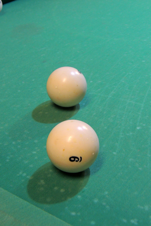 Sport, recreation, game, competition - Playing billiard. Billiards balls an cue on billiards table. Billiard sport concept. Pool billiard game.の写真素材