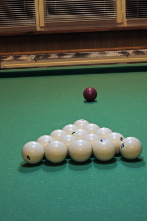 Sport, recreation, game, competition - Playing billiard. Billiards balls an cue on billiards table. Billiard sport concept. Pool billiard game.の写真素材