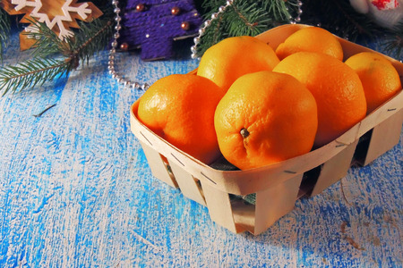 Christmas stone background with snow fir tree and tangerines. Top view with copy spaceの写真素材