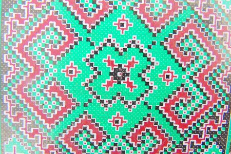 Ukrainian embroidery folk pattern ornament. Design of ethnic textures. Geometric ornament. Embroidered element by flat stitch on flax by red and white cotton threads.の写真素材