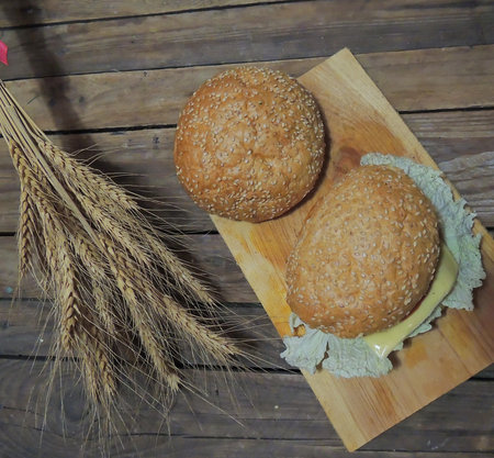 Beef burgers with french fries, beef cutlet, cheese, sauceの写真素材