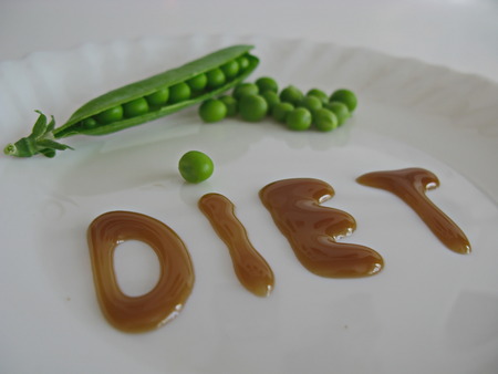 peas lie on a dish word dietの写真素材