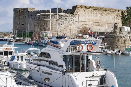 KYRENIA, CYPRUS - WINTER, 2019: Kyrenia castle. Sea pier with boats, ships and yachts. Historical and tourist place.のeditorial素材