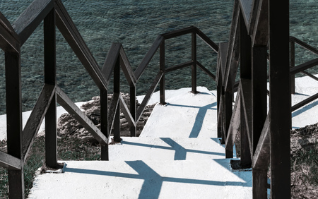 White steps to the sea. Summer landscape background.の写真素材