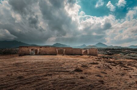 Northern Cyprus Karpaz landscape with ruins against a cloudy sky.の写真素材