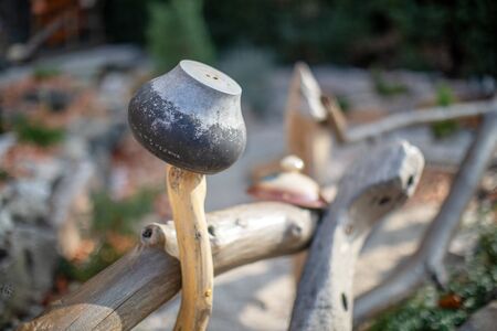 Old metal pot on a wooden fence. Rural scenery. Traditional old Slovenian Ukrainian pot on a wattled fenceの写真素材