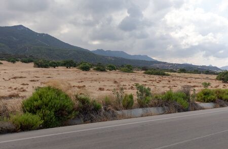 Road in Northern Cyprus. Landscape with road stretches into the distance against the backdrop of mountains.の写真素材