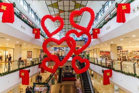 Cyprus - February, 2020: Valentines day decor red balloons in the shape of hearts in shopping mall hanging from the ceiling. Love Day Celebrationのeditorial素材