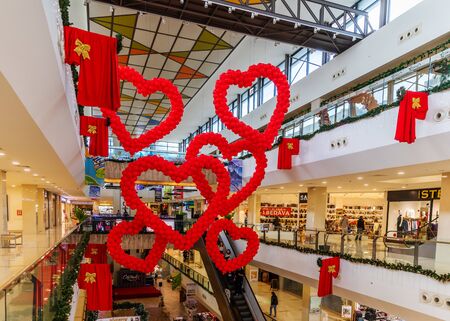 Cyprus - February, 2020: Valentines day decor red balloons in the shape of hearts in shopping mall hanging from the ceiling. Love Day Celebrationのeditorial素材