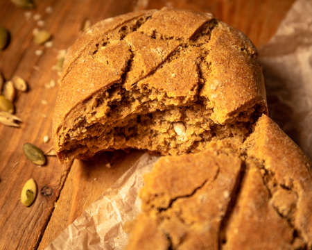 fresh bread and wheat on the wooden table.の写真素材