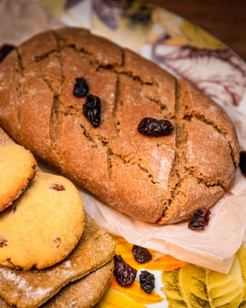 Made by hand fresh bread, tortillas and cookies on dish.の写真素材