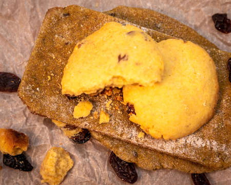 Made by hand fresh tortillas and cookies with raisins on parchment paper.の写真素材