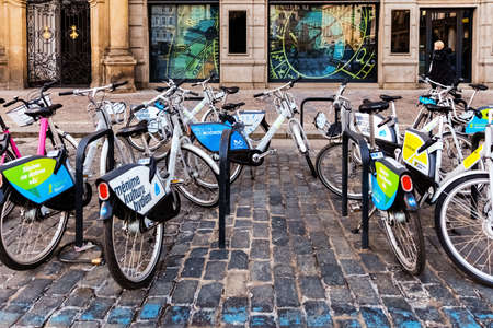 PRAGUE, CZECH REPUBLIC - APRIL 15, 2022: Bikes available for rental, parked in the Old Town, city center.のeditorial素材