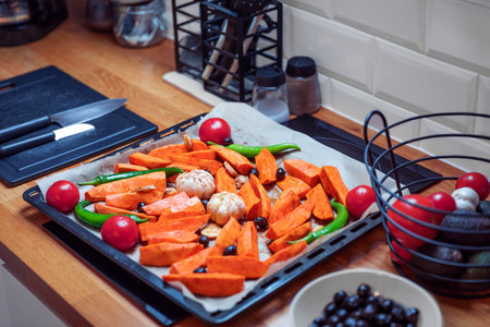Baked Seasonal Vegetables in Oven Tray, Close-up with Copy Spaceの写真素材