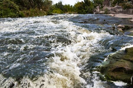 A mountain river flows in a canyon