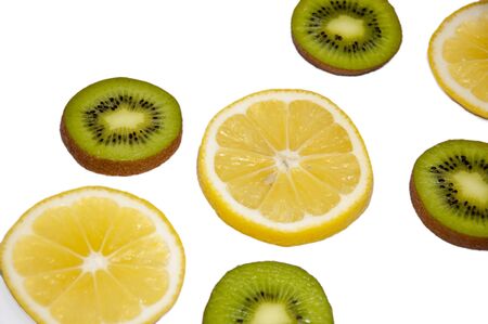 Kiwi and lemon circles on a white backgroundの写真素材