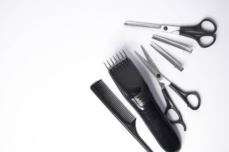 Hairdresser items scissors, comb, clipper on a white backgroundの写真素材