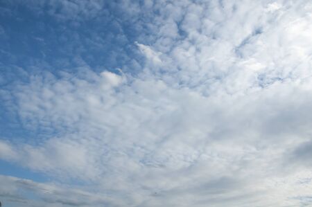 White clouds on a blue sky. Beautiful natural backgroundの写真素材