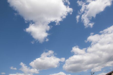 White clouds on a blue sky. Beautiful natural background.の写真素材
