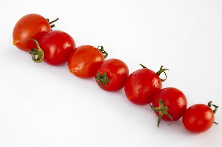 Cherry tomatoes close-up on a white background. Healthy eating Vegetables, vitamins.の写真素材