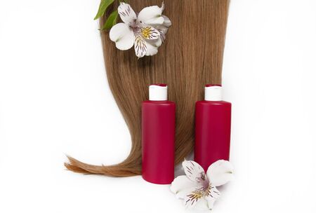 Cosmetic products on a white background. Hair care. Healthy and beautiful hair. Copy space for textの写真素材
