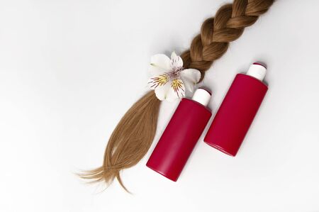 Cosmetic products on a white background. Hair care. Healthy and beautiful hair. Copy space for textの写真素材
