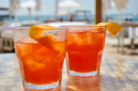 Cocktails on the beach. Bright cold drinks on the beach in summer. Summer vacation and travel concept.の写真素材