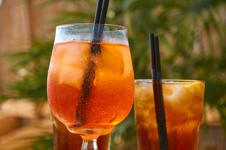 Cocktails on the beach. Bright cold drinks on the beach in summer. Summer vacation and travel concept.の写真素材