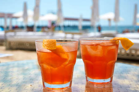 Cocktails on the beach. Bright cold drinks on the beach in summer. Summer vacation and travel concept.の写真素材