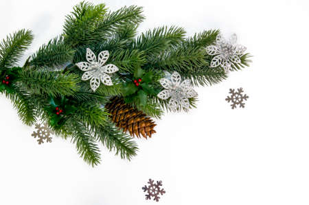 Christmas background. Fir branches with decorations on a white backgroundの写真素材