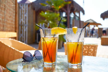 Cold drink cocktail on the beach. Summer restの写真素材