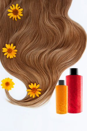 Cosmetic for hair and flowers for hair on a white background. Healthy and beautiful hair. haircare. Copy space for textの写真素材