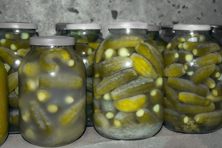 Jars of salted cucumbers. canned foods. Canned and preserved foodsの写真素材