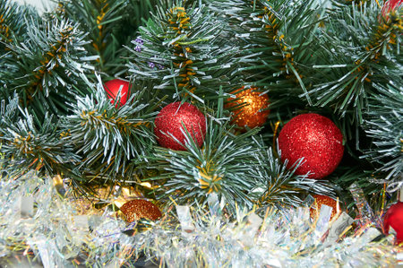 Christmas background with Christmas tree branches, red layers and silver tinsel. Christmas decorationsの写真素材