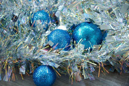 Blue Christmas balls in silver tinsel. Christmas backgroundの写真素材