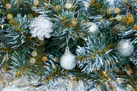 Christmas background with Christmas tree branches, silver layers and silver tinsel. Christmas decorationsの写真素材