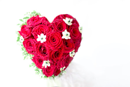 Flower heart of red rose ornithogalum flowers isolated on white. Symbol of love in a greeting card for valentine's day, wedding, mother's day.の写真素材