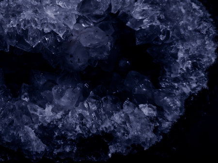 shiny dark stone crystal in color mix of black violet and black blue future dusk on elegant surface sparkles with mesmerizing effect. mineralの写真素材