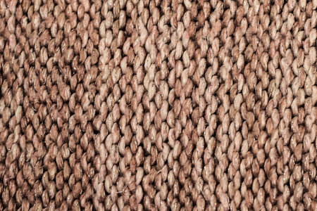 Gradient texture of weaving of woolen fabric threads, large knitting with 3D effect in color 2025 mocha mousse rich brown, coffee color, soft brownの写真素材