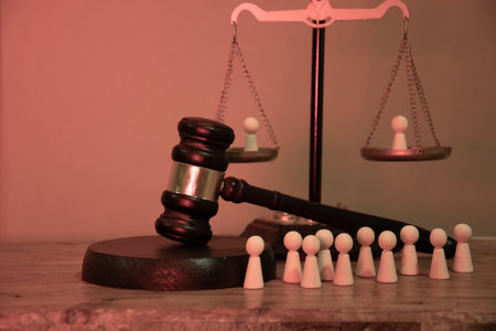 People on the scales of a judge, next to a line of figures awaiting the court's decision. Social justice, comparison, inequality, trial, public condemnation, discipline, punishmentの写真素材