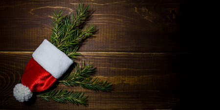 Santa's christmas tree cap Christmas New Year wooden vintage background and textureの写真素材