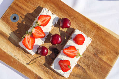 Summer fruit and berries on a cutting board proper food preparation home cooking foodphoto