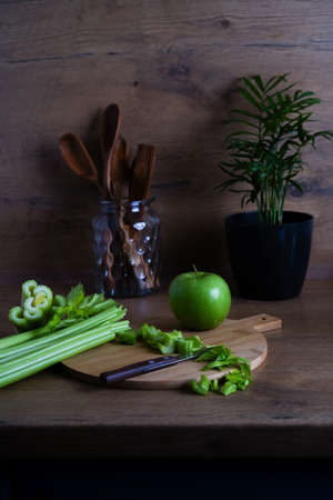 green apple and chopped celery for a healthy lifestyle and weight lossの写真素材