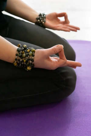Close up hand. Woman do yoga outdoor. Woman exercising and zen relax and relaxation yoga. Healthy and Lifestyle Conceptの写真素材