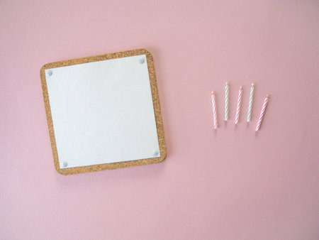 top view of blank notepad page on pink backgroundの写真素材