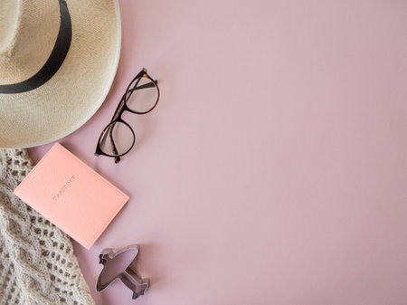 Flat lay traveler accessories on pink background with blank space for text, vacation concept.の写真素材