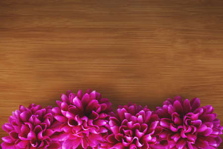 Purple flowers on wooden background, copy space. Floral arrangement of dahlias. Happy Mother's Day, Woman's Day, Valentine's Day or Birth Day Cake. Greeting card.の写真素材
